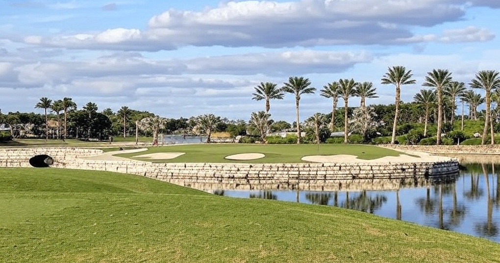 Cedar Hammock Country Club in Naples FL putting green with water via Grok