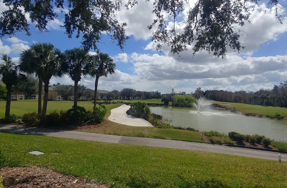 Cypress Woods Golf & Country Club in Naples FL fairway water view via Grok