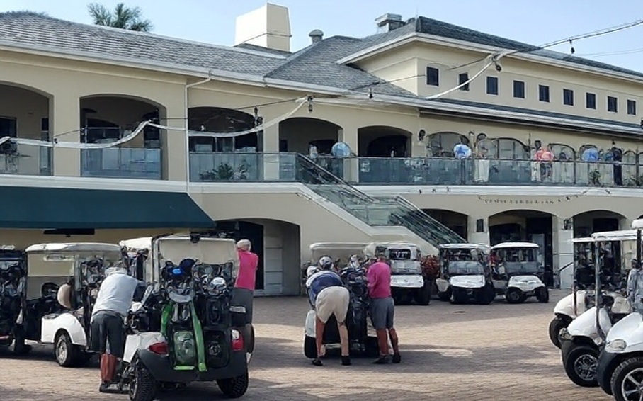 Kensington Golf & Country Club in Naples FL clubhouse view with golfers via Grok