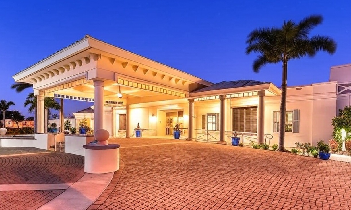 The Moorings Golf & Country Club in Naples FL clubhouse view via Grok