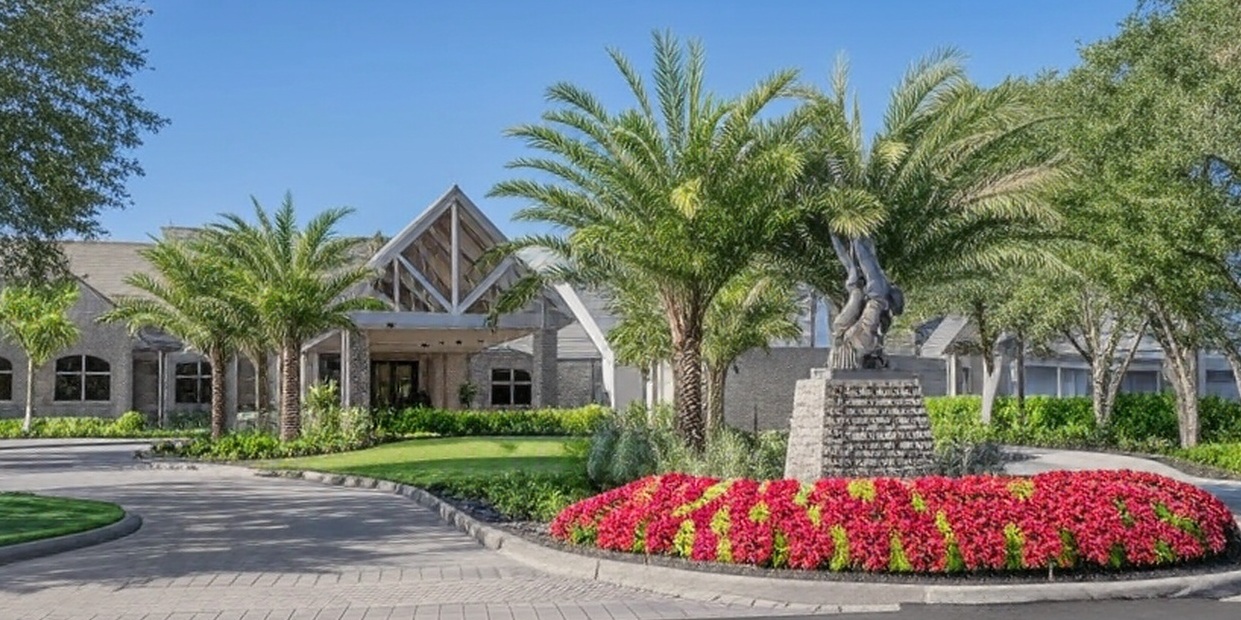 The TwinEagles Club in Naples FL view of clubhouse via Grok