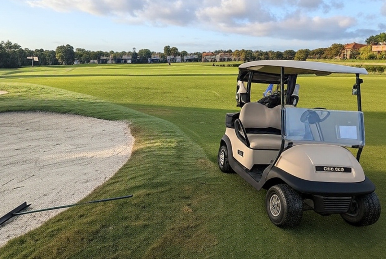Valencia Golf & Country Club in Naples FL golf cart next to sand trap via Grok