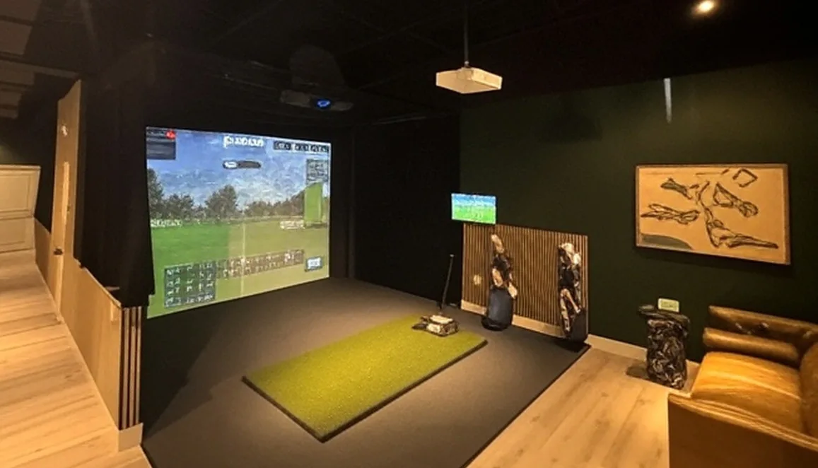 The Albatross Den in Tequesta Florida view of indoor golf simulator via Grok