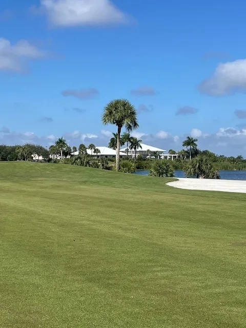 View of Clubhouse from 9th Fairway on Hawk course at Osprey Point Golf Course via SoFloGolf