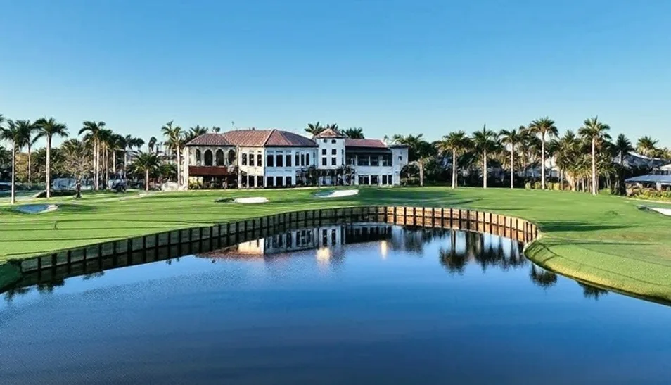 Royal Palm Yacht & Country Club in Boca Raton Florida view of clubhouse and green with water in foreground via Grok