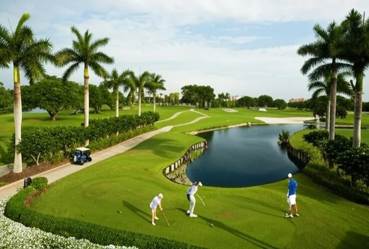 The Boca Raton Club Course in Florida view of tee box with fairway and golfers via Grok
