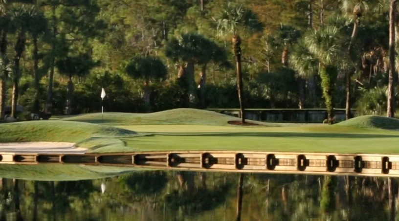 Old Marsh Golf Club in Palm Beach Gardens Florida view of green surrounded by water via Grok